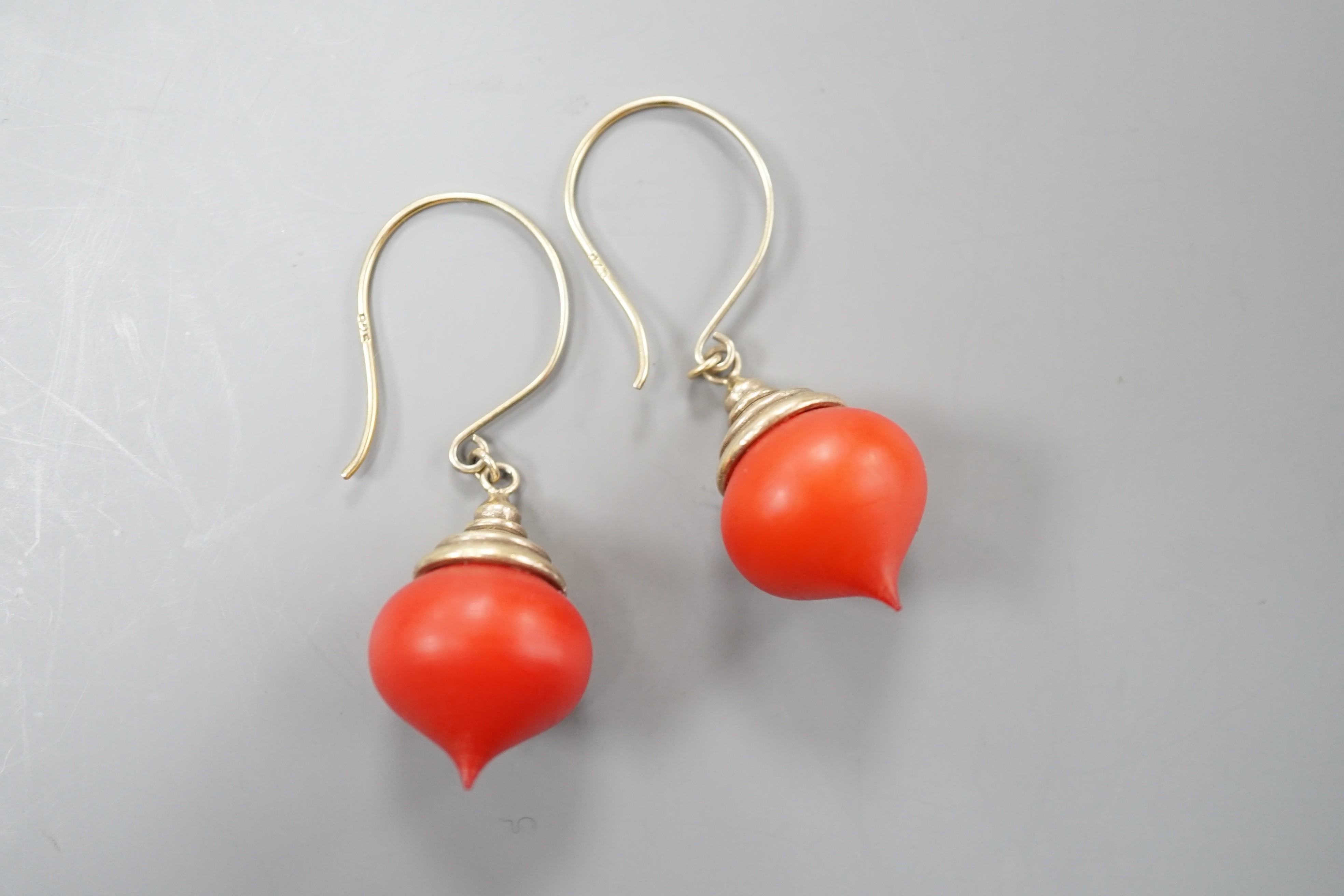 A pair of gilt white metal and stained wood drop earrings, 30mm.
